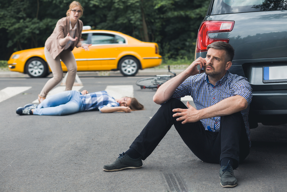 Pedestrian in the street after a car accident